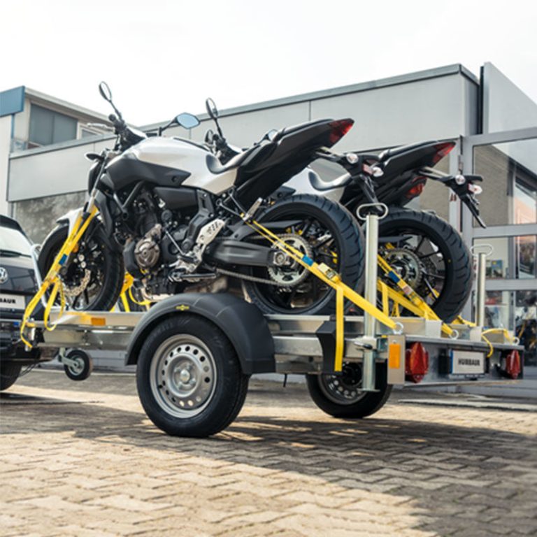 découvrez notre remorque moto sécurisée, idéale pour transporter votre moto en toute tranquillité. robuste, fiable et facile à utiliser, elle garantit la sécurité de votre deux-roues sur tous vos trajets.